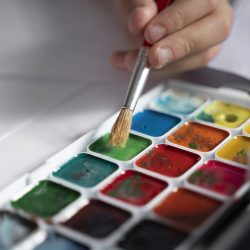 young-kid-painting-with-watercolor